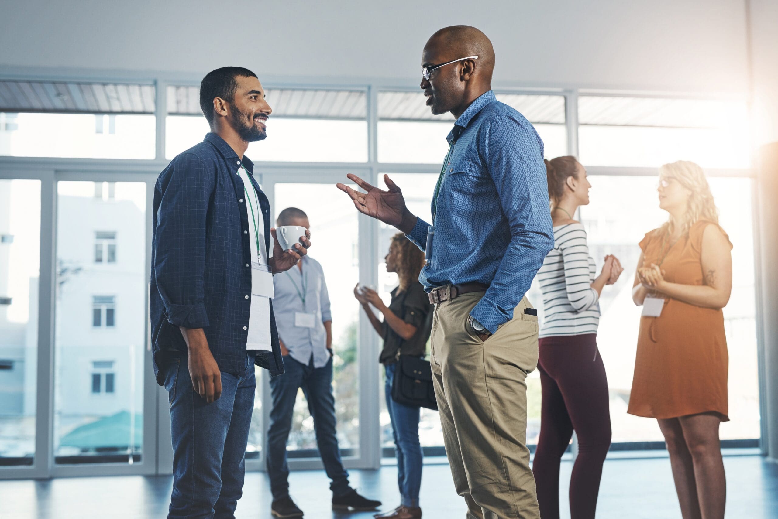 Creative men talking at networking event