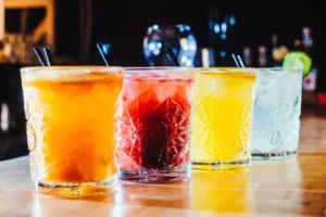 colorful cocktails lined up in bar