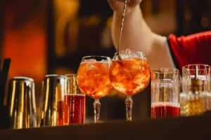 aperol spritz being prepared by bartender