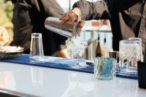 bartender pouring drink in portable bar